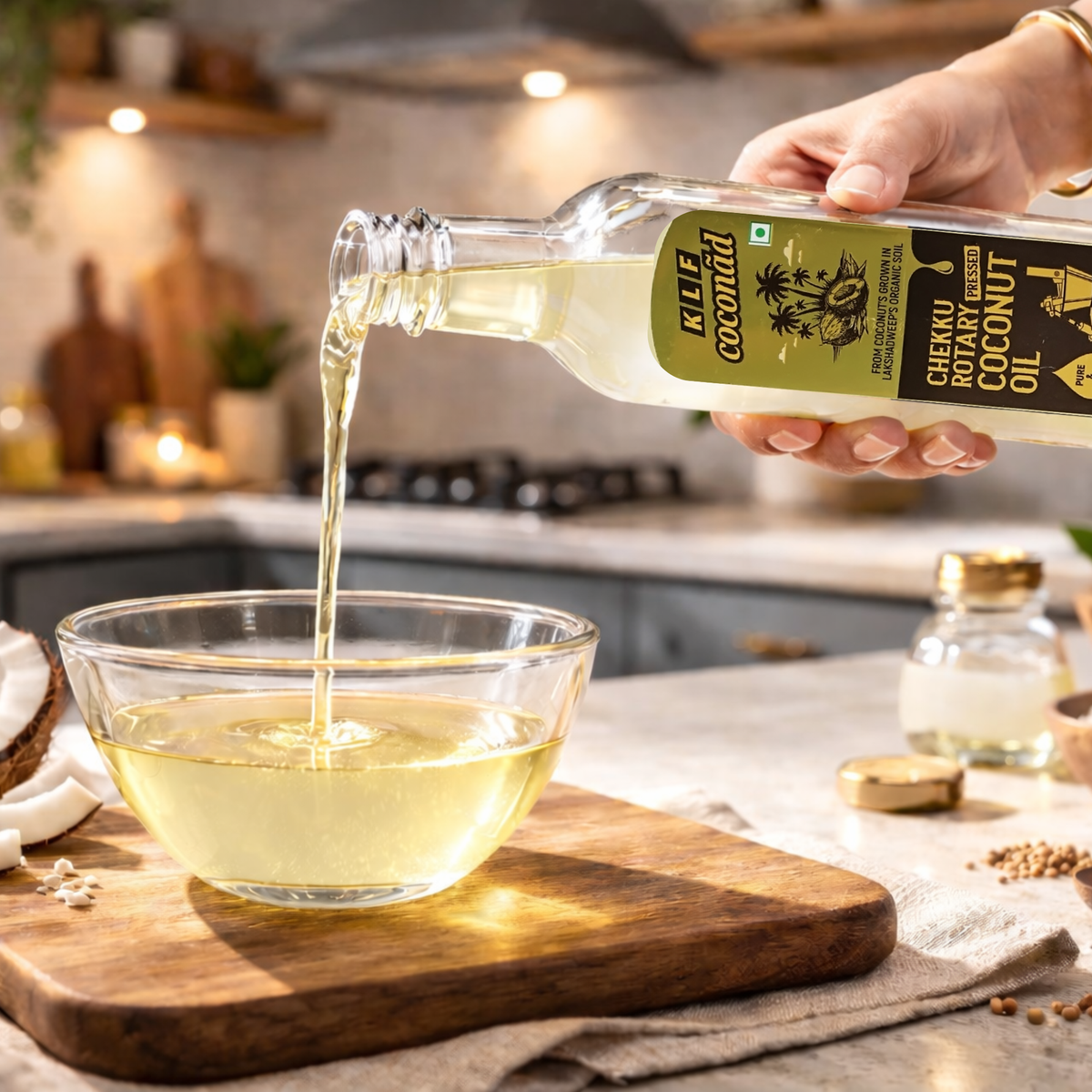 KLF Coconad Chekku Rotary Pressed Coconut Oil — product being poured